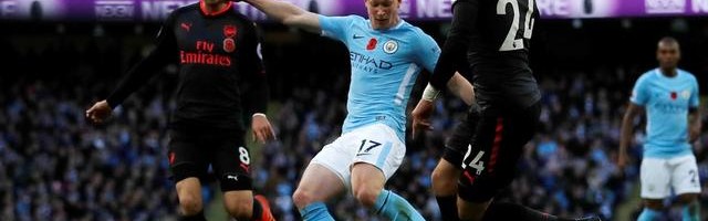  阿森纳零封曼城登顶积分榜首  